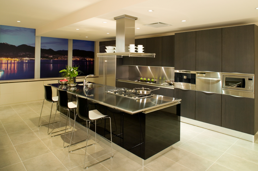 A green kitchen from top to bottom cabinets to floors